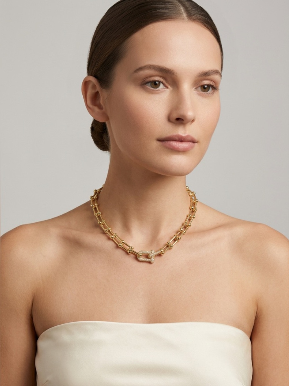 80. Brass horseshoe necklace